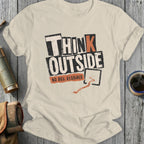 Cream t-shirt with "THINK OUTSIDE NO BOX REQUIRED" text and orange arrow.