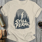 Cream t-shirt with "STILL FERAl NO MAP. NO SERVICE. NO PROBLEM." and a lightning bolt.
