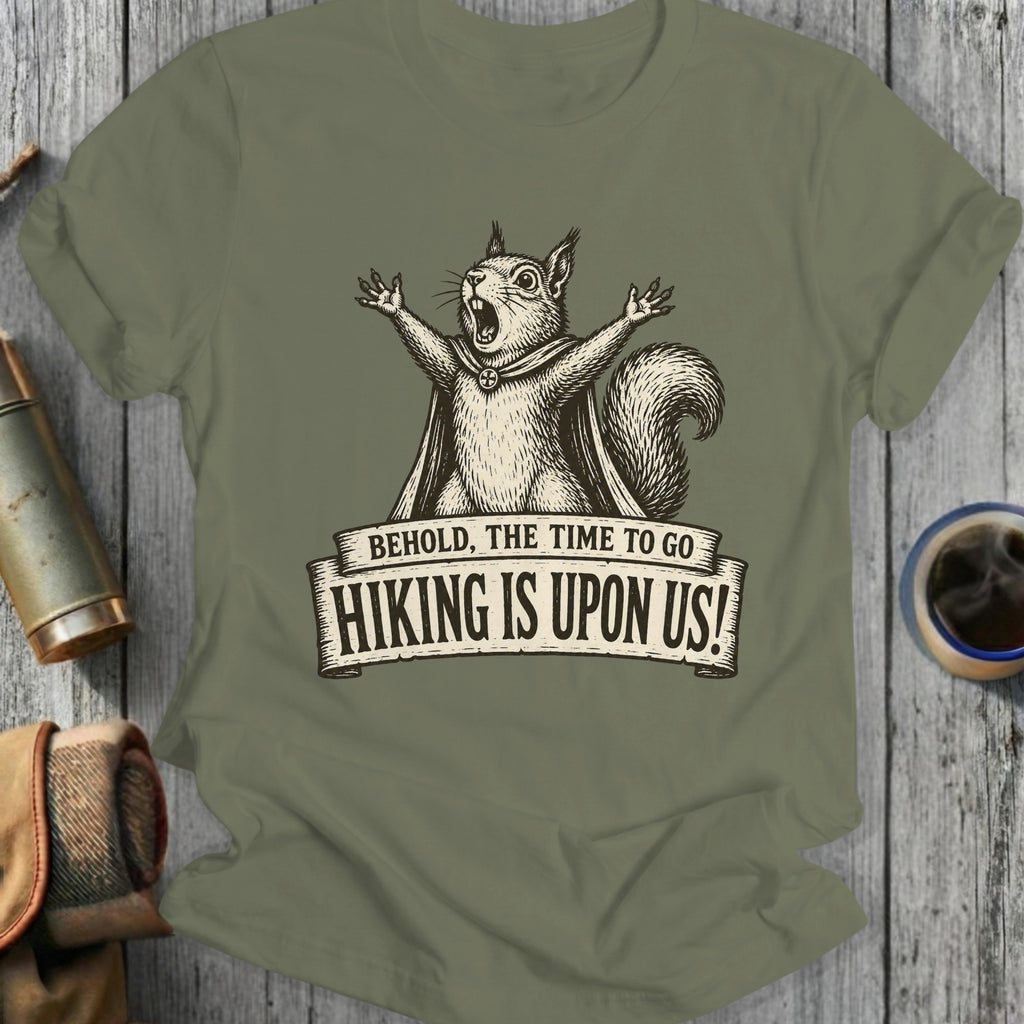 T-shirt graphic of a screaming squirrel in a cape with text "BEHOLD, THE TIME TO GO HIKING IS UPON US!"