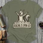T-shirt graphic of a screaming squirrel in a cape with text "BEHOLD, THE TIME TO GO HIKING IS UPON US!"
