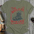 Olive green t-shirt with distressed graphic of boot with flowers and text "The Walk It Off Hiking Committee".