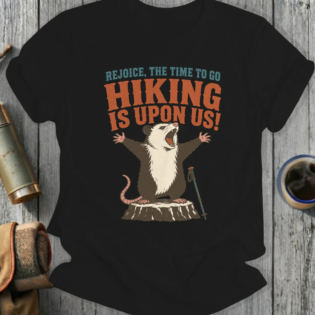 Opossum on stump with arms up, "Rejoice, The Time To Go Hiking Is Upon Us!"