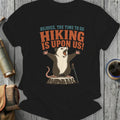 Opossum on stump with arms up, "Rejoice, The Time To Go Hiking Is Upon Us!"