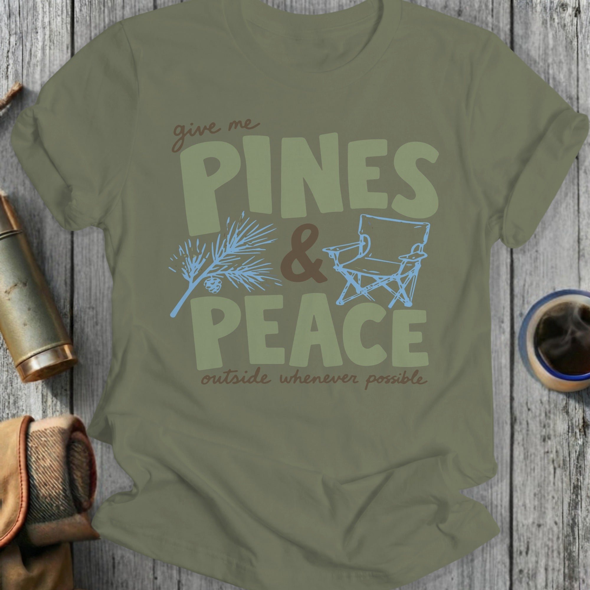 Olive green t-shirt with text "give me PINES & PEACE outside whenever possible".