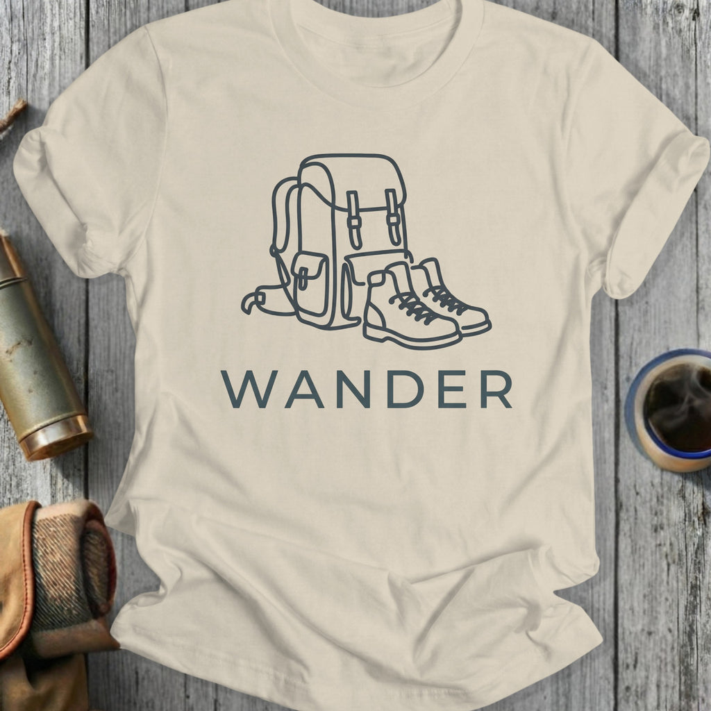 T-shirt with outline of backpack and hiking boots above the word WANDER.