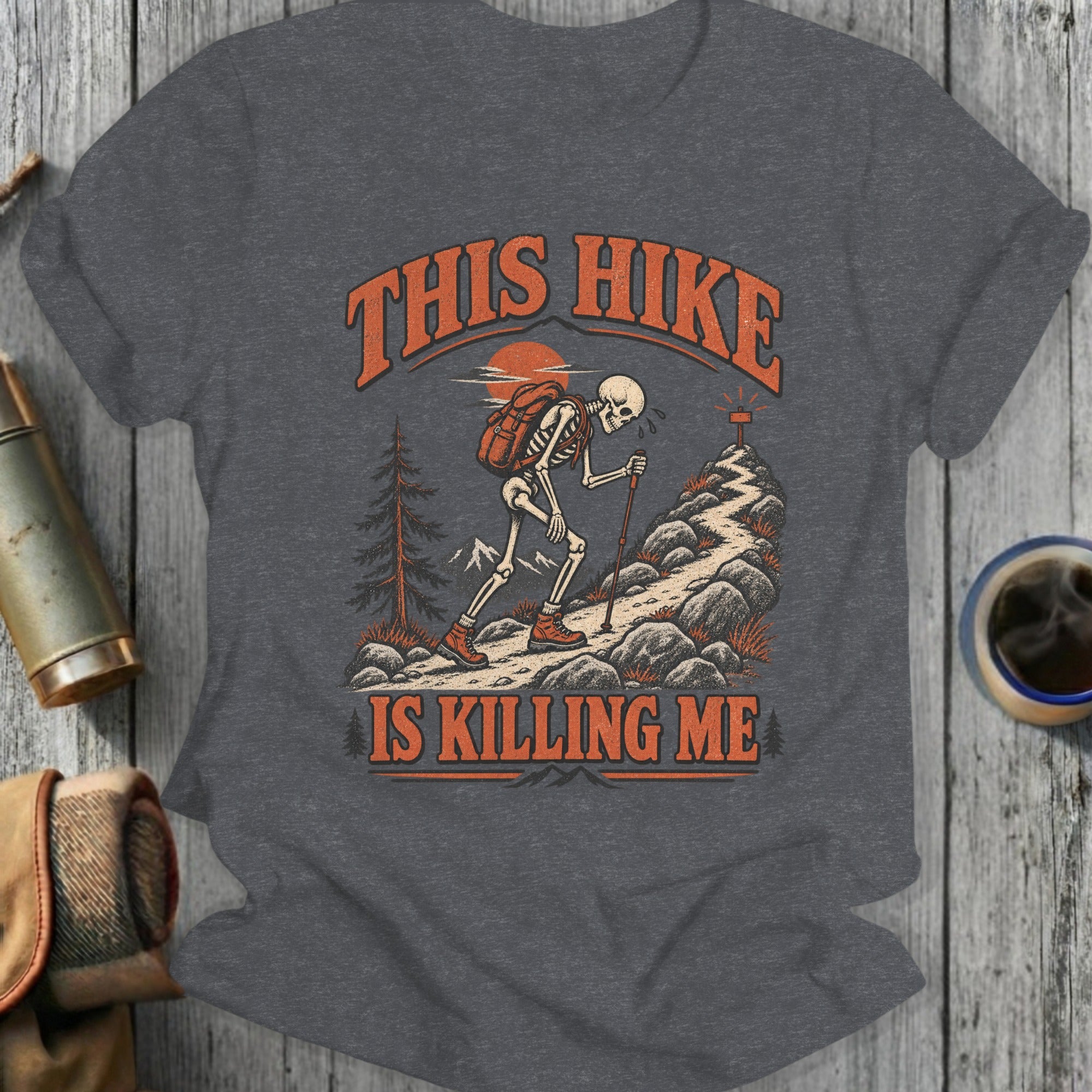 Skeleton hiking up a rocky mountain path, text says "This Hike Is Killing Me".