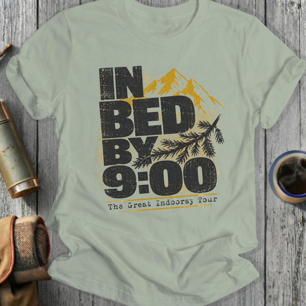 Light green t-shirt with black text "IN BED BY 9:00 The Great Indoorsy Tour" and mountains.