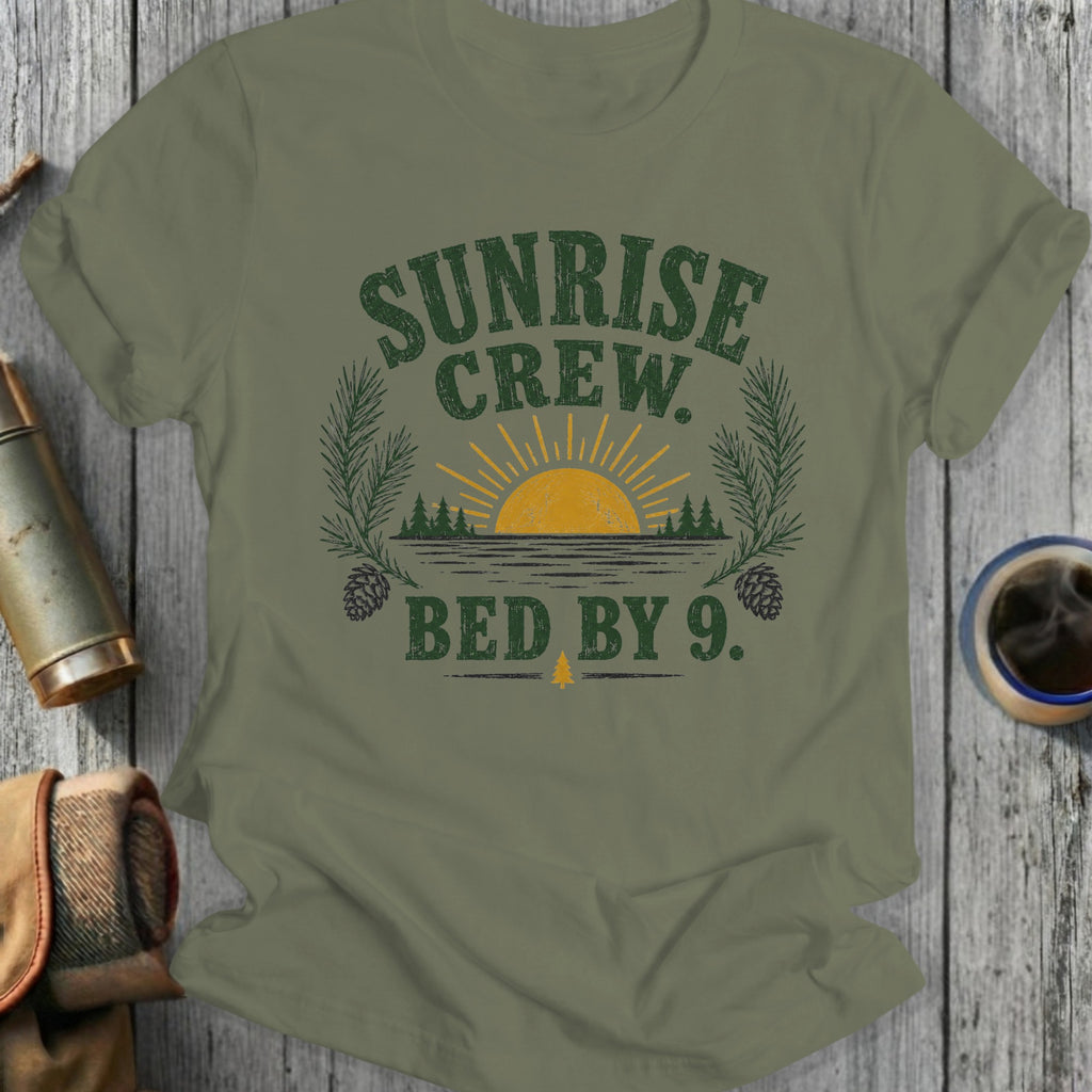 Olive green t-shirt with "SUNRISE CREW. BED BY 9." graphic.