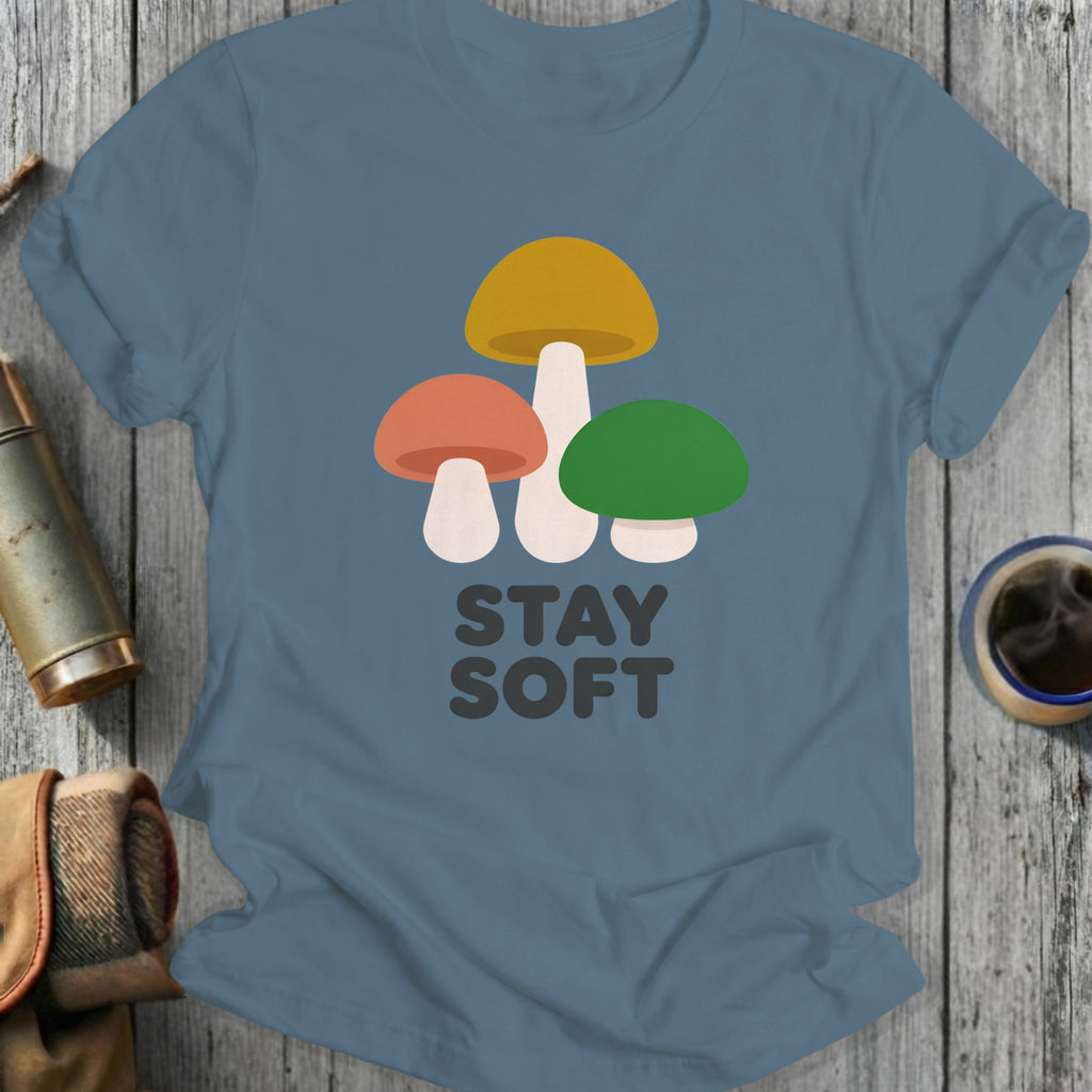 T-shirt with three colorful mushrooms and "STAY SOFT" text.
