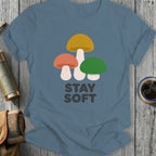 T-shirt with three colorful mushrooms and "STAY SOFT" text.