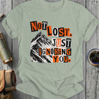 T-shirt with "Not lost. Just ignoring you." text over a mountain.