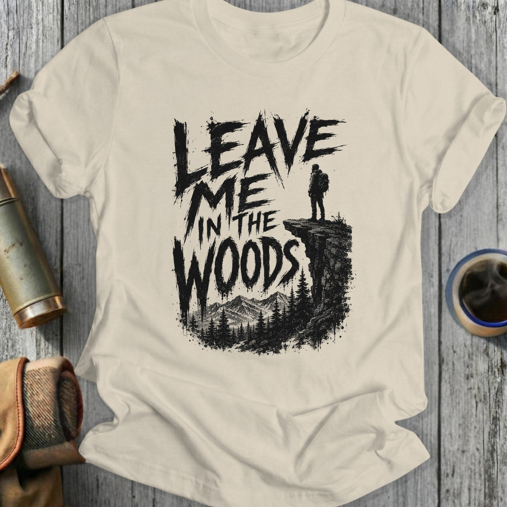 Leave Me In The Woods graphic t-shirt with hiker on cliff overlooking forest.