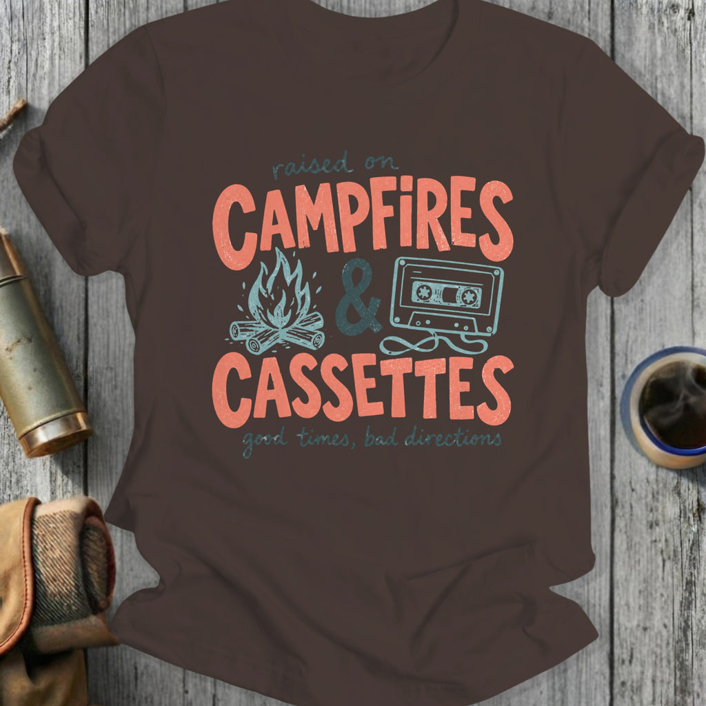 Brown t-shirt with "Raised on Campfires & Cassettes" graphic.