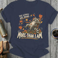 Raccoon relaxing in chair with falling leaves and text "The leaves are doing more than I am".