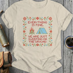 T-shirt with embroidered campsite and text "EVERYTHING IS FINE, WE ARE JUST SLEEPING ON THE GROUND".