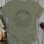 Bigfoot and alien roast marshmallows by campfire, with "Leave No Trace" text.