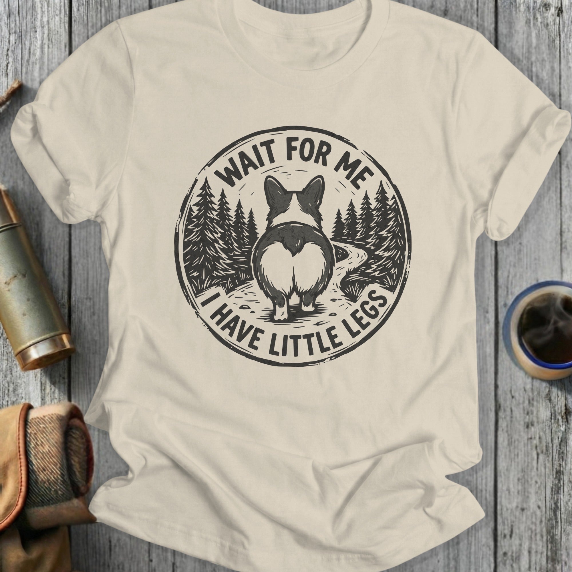 Cream t-shirt with "Wait For Me I Have Little Legs" and a Corgi butt.
