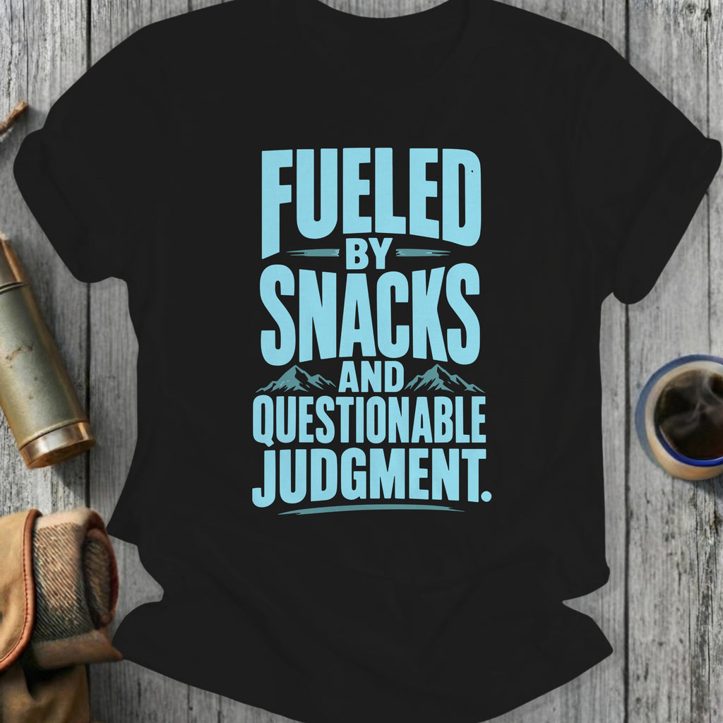 Black t-shirt with text "Fueled by Snacks and Questionable Judgment"