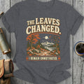 T-shirt with text "The Leaves Changed. I Remain Unmotivated." and autumn landscape.