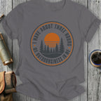 Gray t-shirt with a circular graphic featuring trees, a sunset, and text.