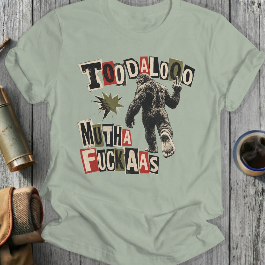 Bigfoot gives middle finger holding "TOODALOO MUTHA FUCKAAAS" text.