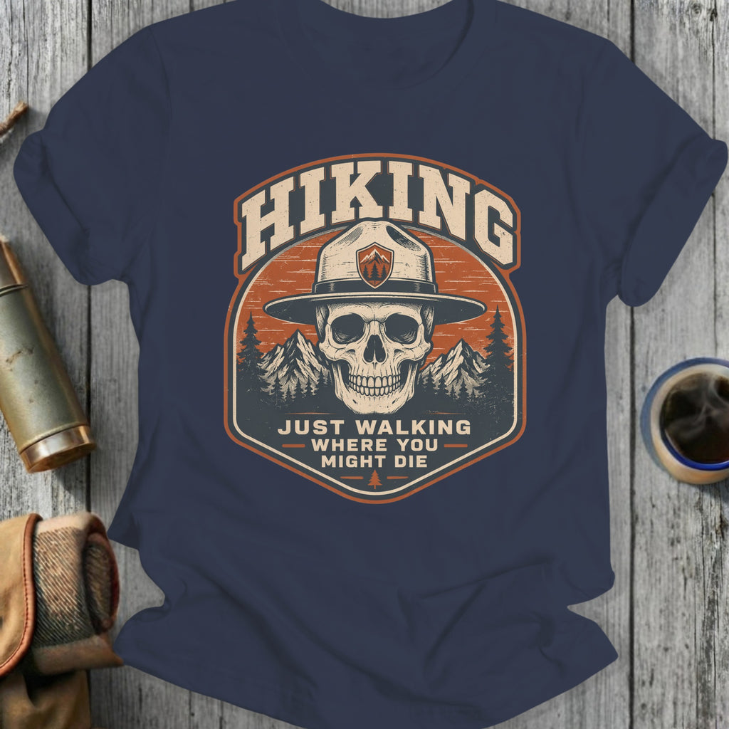 Hiking skull wearing ranger hat, mountains, "Just walking where you might die" text.