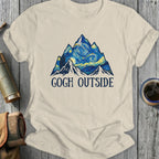 Mountains with starry sky, "Gogh Outside" text on cream t-shirt.