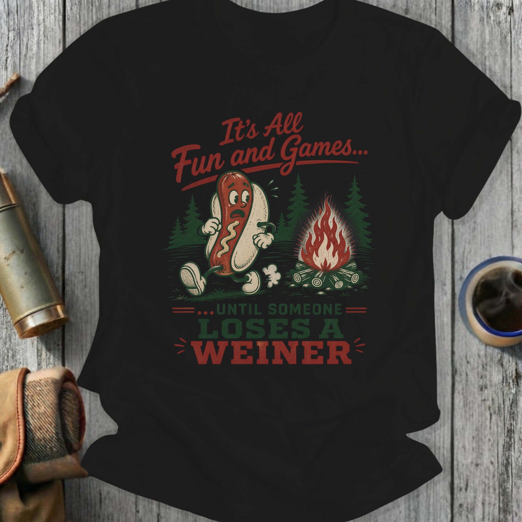 T-shirt with hot dog character and text "It's All Fun and Games... Until Someone Loses a Weiner".