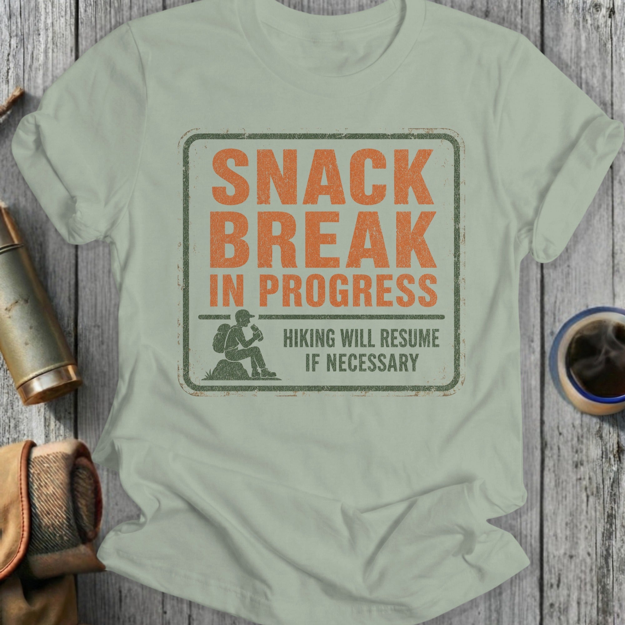 T-shirt with "SNACK BREAK IN PROGRESS HIKING WILL RESUME IF NECESSARY" text.