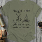 T-shirt with stick figure Gary meditating by a campfire, text reads "This is Gary. Gary has no signal. Gary is thriving."