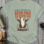 Opossum with arms outstretched on a tree stump, text says "Rejoice, the time to go hiking is upon us!"