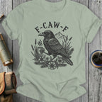 F-CAW-F Crow Holding Coffee T-Shirt with Mountain Scene