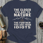 Navy t-shirt with text "THE CLOSER YOU ARE TO NATURE THE FURTHER YOU ARE FROM IDIOTS"