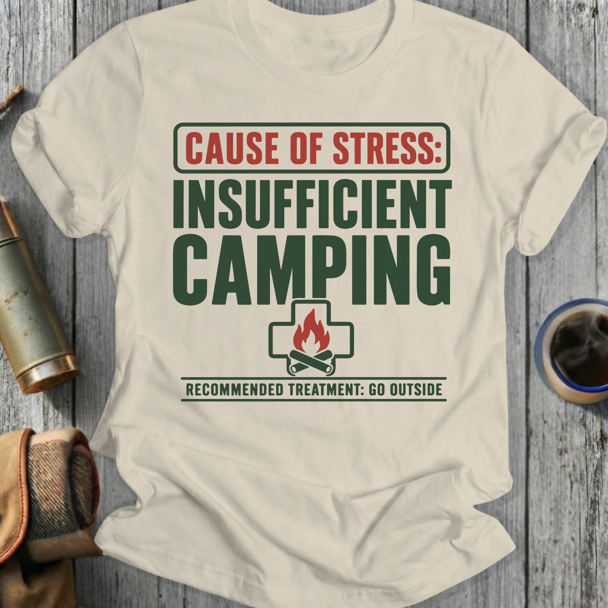 Cream shirt with green text: "Cause of stress: Insufficient camping. Recommended treatment: Go outside."