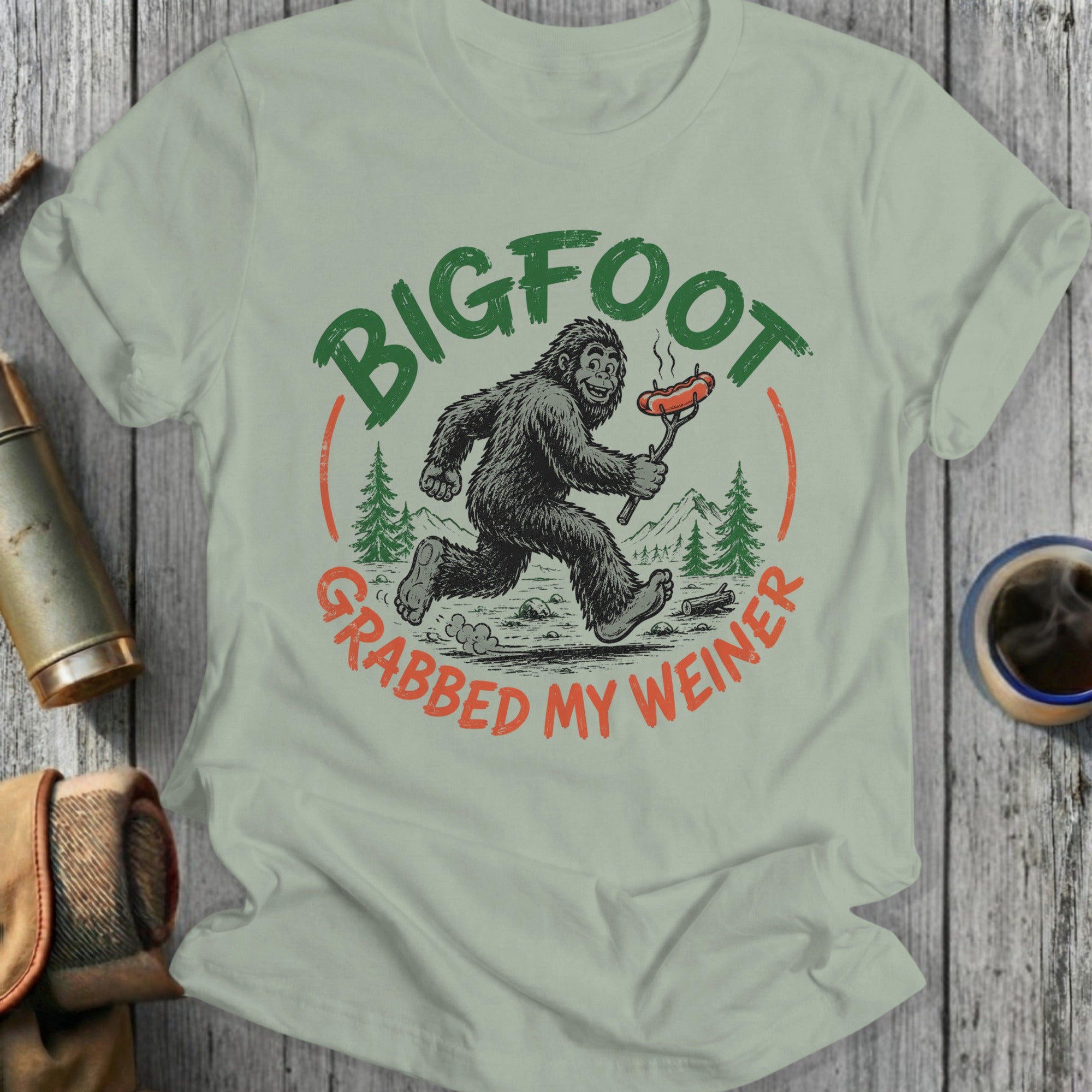 Bigfoot holding a hot dog on a stick with "Bigfoot grabbed my weiner" text.