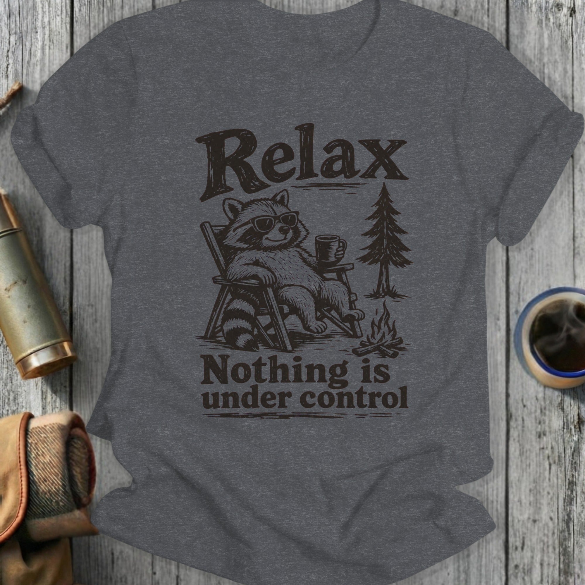 Raccoon wearing sunglasses sitting in a chair with "Relax Nothing is under control" text.