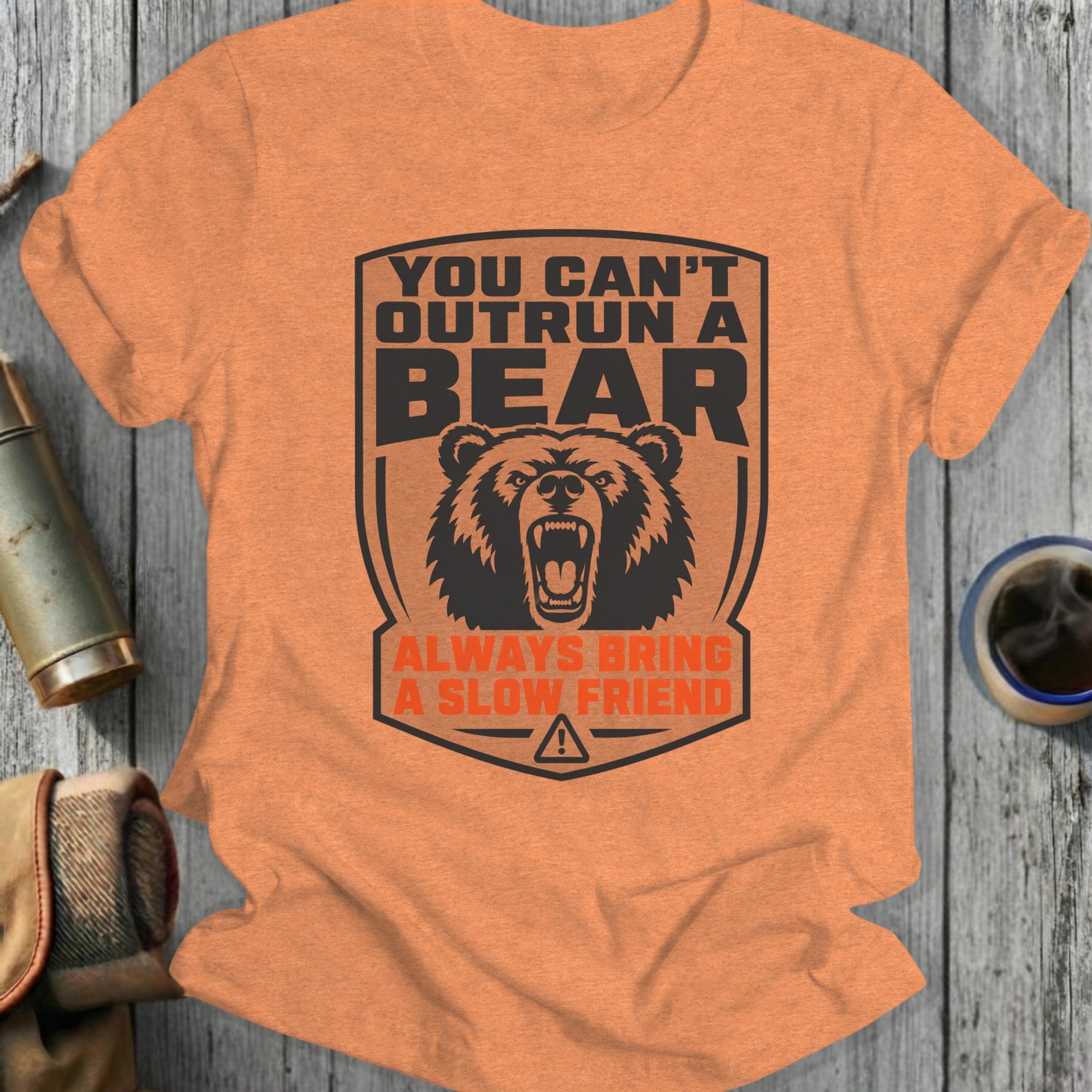 Orange t-shirt with "You Can't Outrun A Bear, Always Bring A Slow Friend" text.