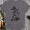 Gray t-shirt with vintage graphic of a tortoise hiking with backpack and text "GO AHEAD, I'LL CATCH UP".