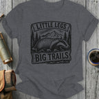 Gray t-shirt with "Little Legs, Big Trails" text and badger graphic.