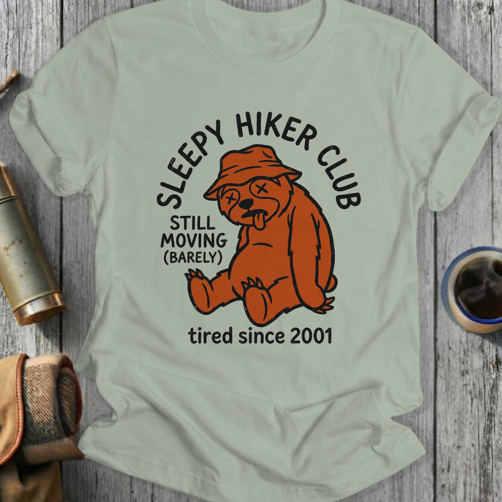Sleepy hiker club bear graphic on a light grey t-shirt.