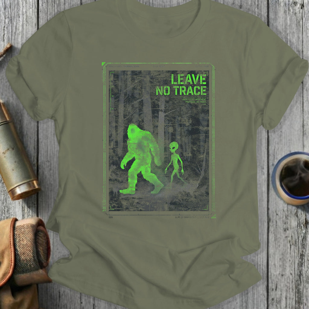 Green t-shirt featuring Bigfoot and alien silhouette graphic with "LEAVE NO TRACE" text.
