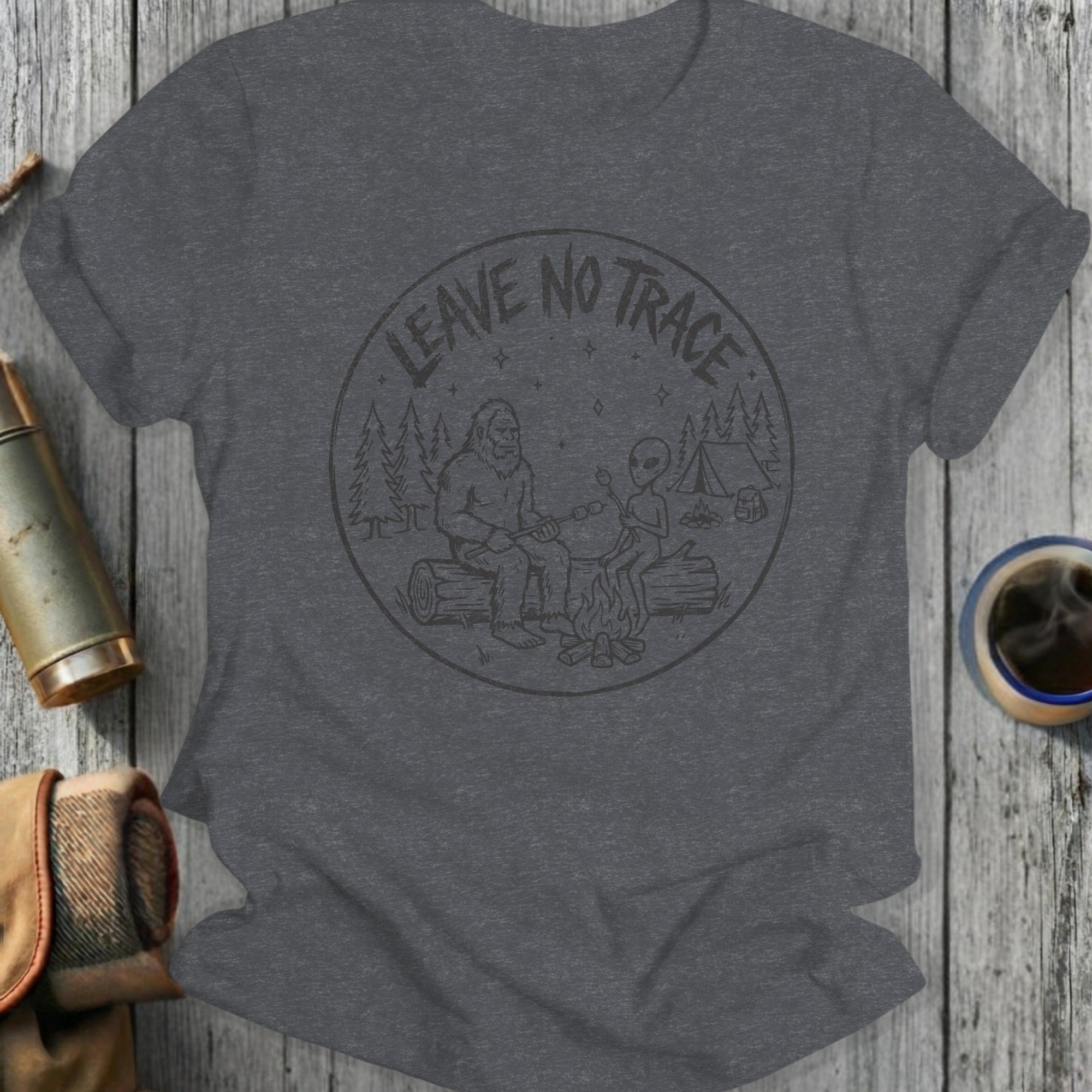 Gray t-shirt with a circular graphic of Bigfoot and an alien roasting marshmallows.