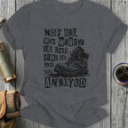 T-shirt with text "Not all who wander are lost, some are just annoyed" over a boot.