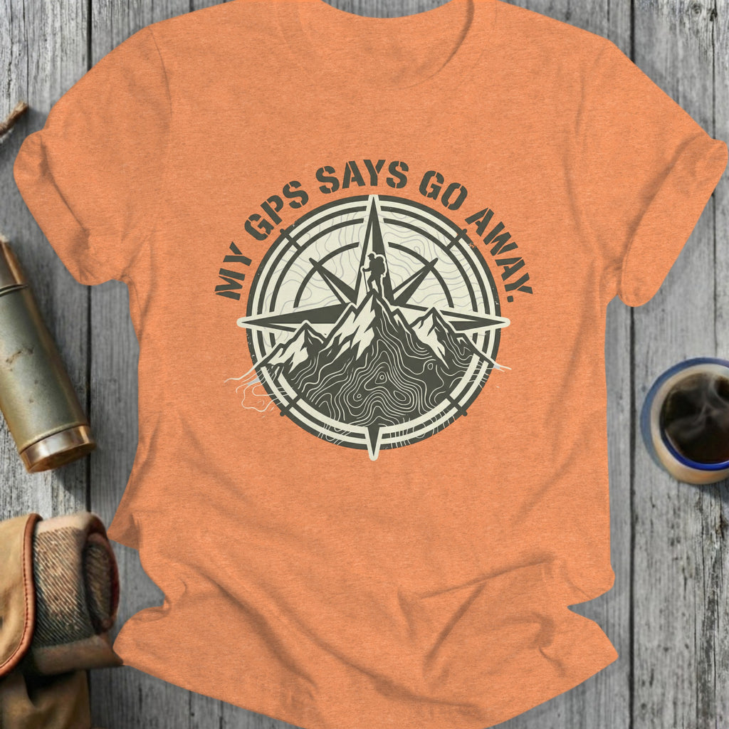 Orange t-shirt with compass graphic and mountain with text "My GPS Says Go Away."