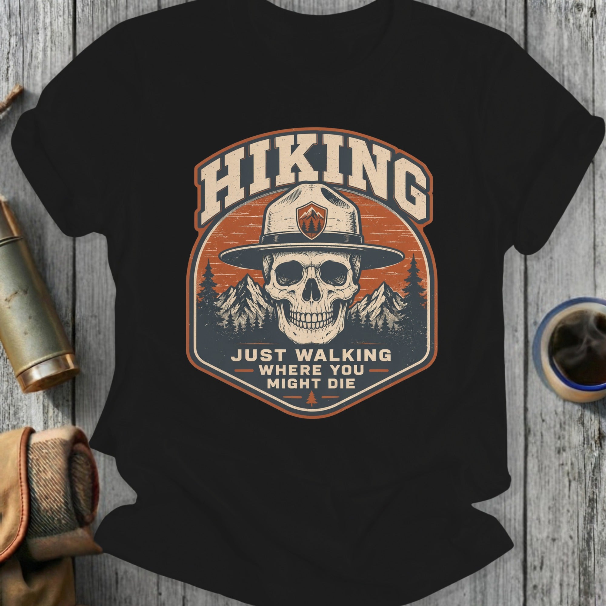 Black t-shirt with skull and hiking quote "JUST WALKING WHERE YOU MIGHT DIE".