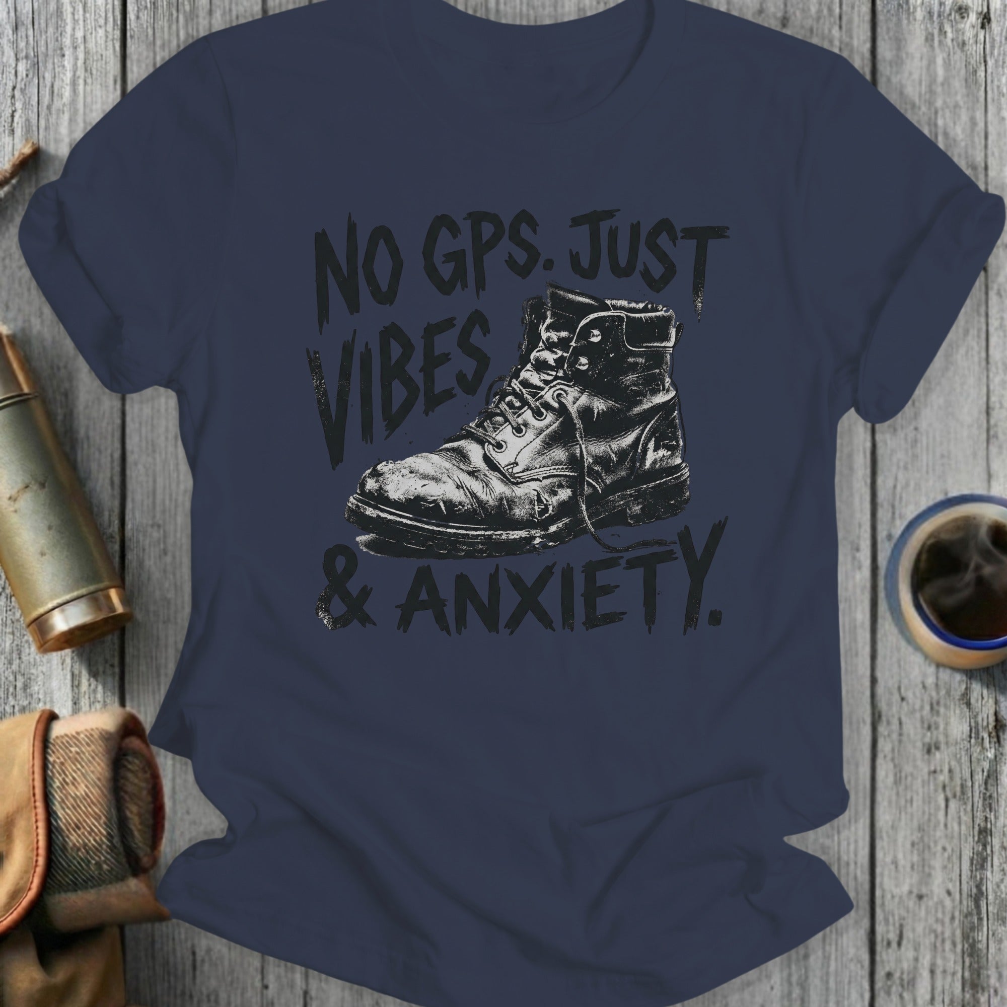 Black graphic tee with a vintage boot and text "NO GPS. JUST VIBES & ANXIETY."