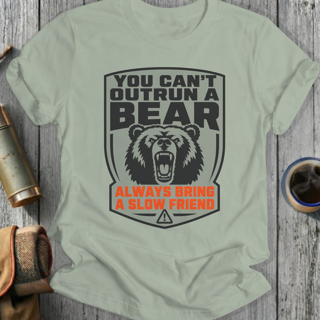 T-shirt with "You can't outrun a bear, always bring a slow friend" text and bear graphic.