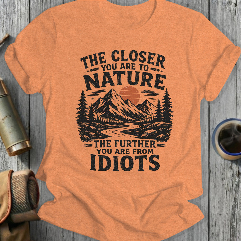 Orange t-shirt with black text "The closer you are to nature the further you are from idiots."
