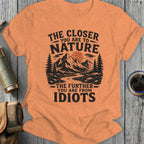 Orange t-shirt with black text "The closer you are to nature the further you are from idiots."