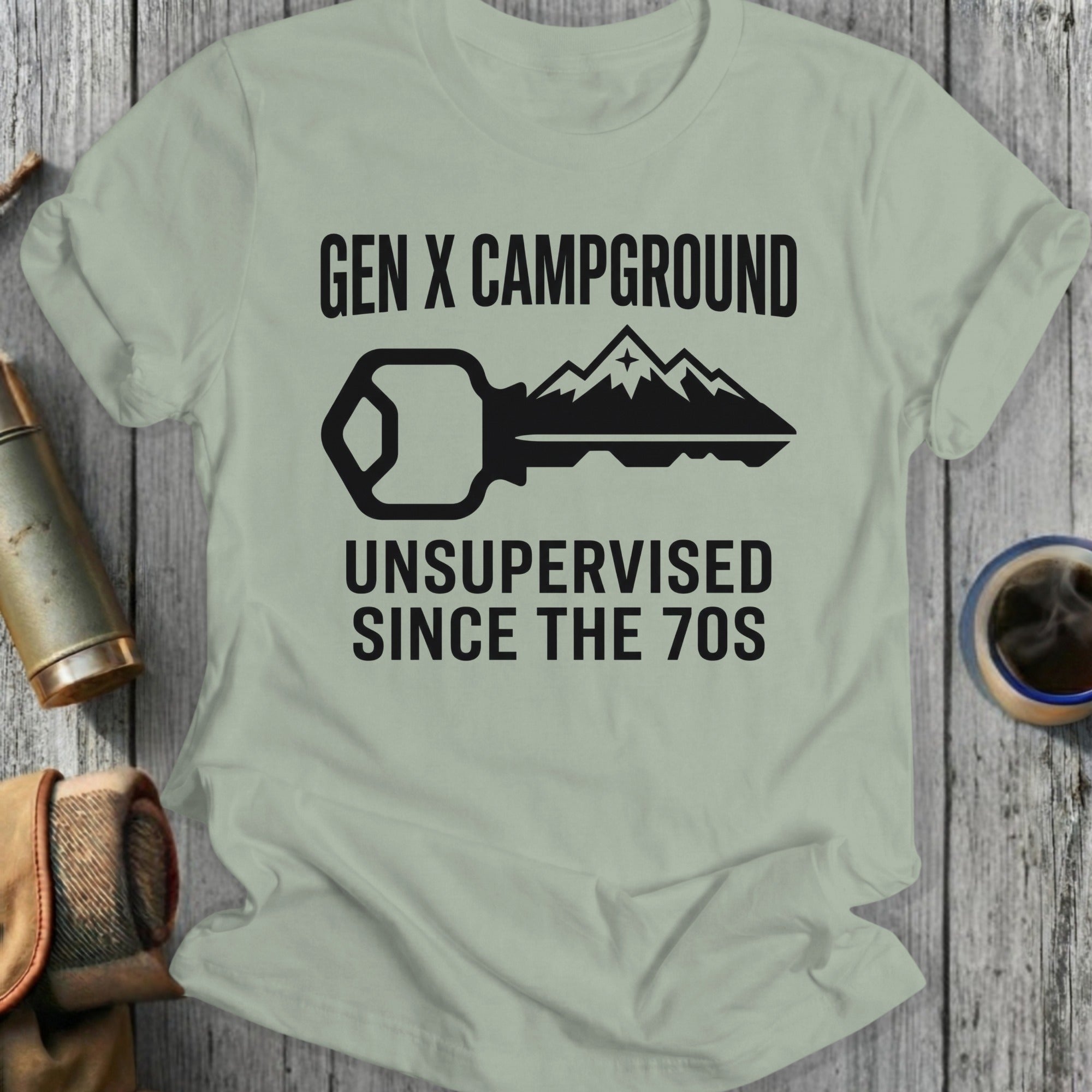 Gen X Campground Unsupervised Since The 70s graphic on a light green t-shirt.